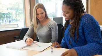 CEMS students working together at a desk