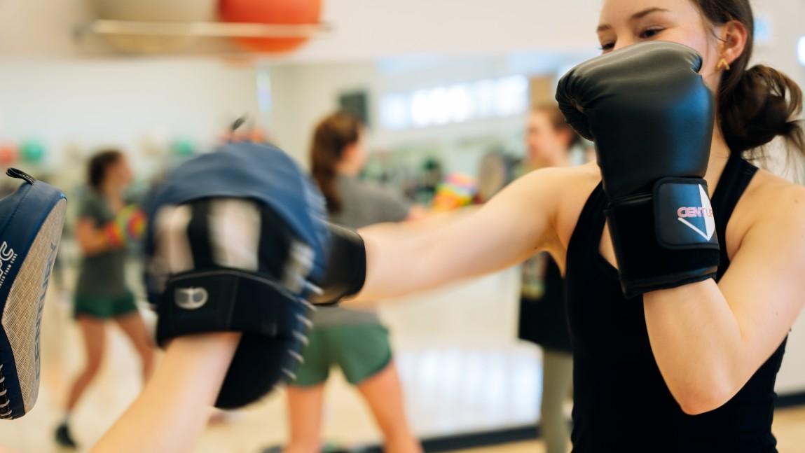 Students participate in a UVM kickboxing class 