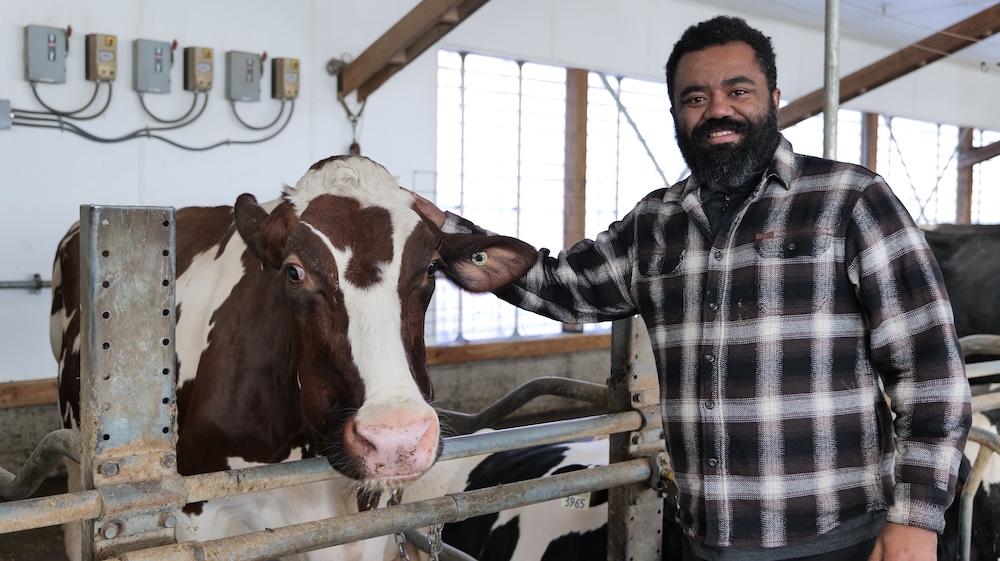 Joao Costa with a cow