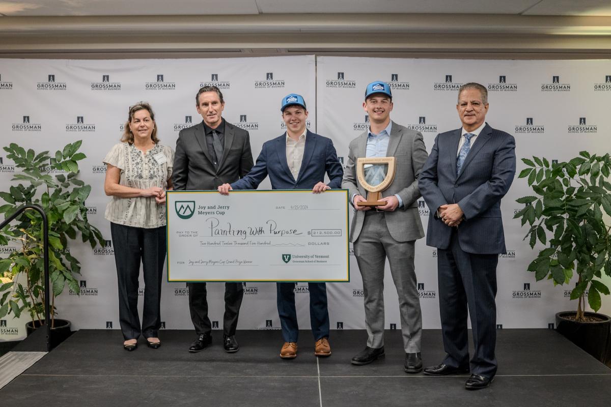 Grand prize winners from Painting With Purpose pose with Joy and Jerry Meyers Cup donors and Grossman School Dean Sanjay Sharma