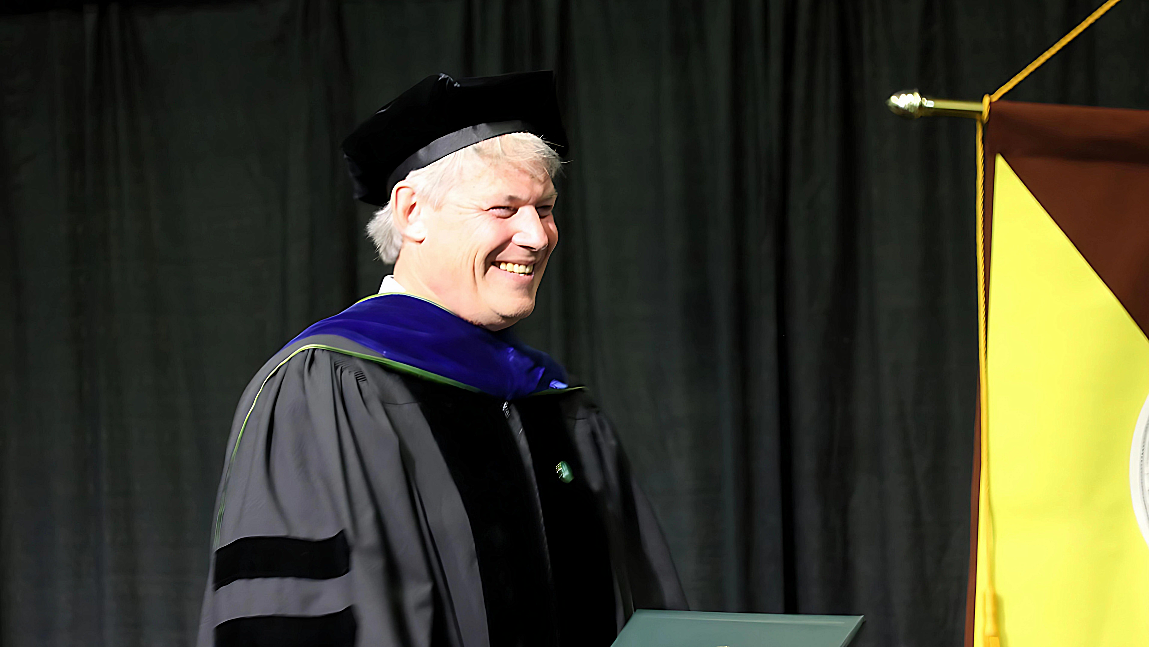 Allan Strong wearing regalia at the RSENR Graduation Celebration 2024