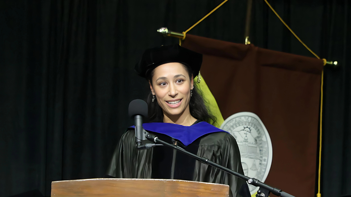 Rebecca Stanield McCown standing at the podium at the 2024 Graduation Celebration