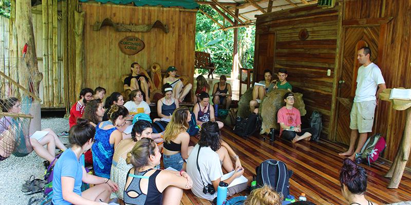 Students in Costa Rica outdoor classroom listen to a community partner speak