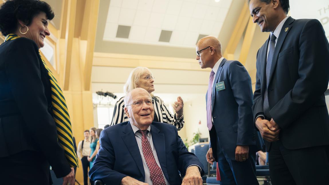 People gathered around former Senator Patrick Leahy