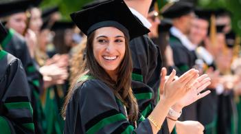 Woman in Graduation Robes Clapping