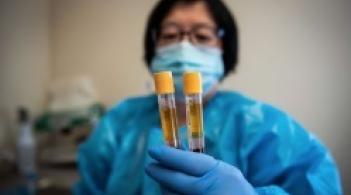 Vaccine Researcher holding vials