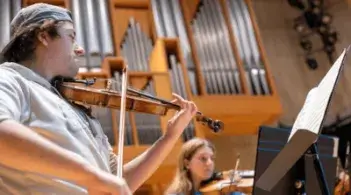 Student playing a violin