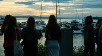 Students enjoying the Burlington waterfront at sunset