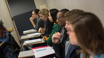 Group of student having conversation and taking in a classroom 