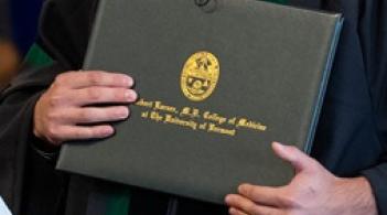 person holding diploma