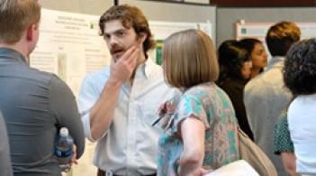 med student chatting at poster session