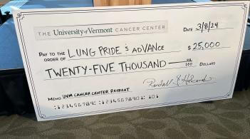 UVM Cancer Center oversized check for $25,000.