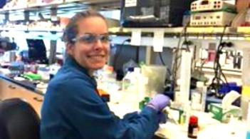 Amanda Graves smiling for the camera, working diligently in the lab