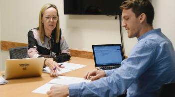 A mock interview for a Davis Center position in a conference room.