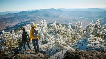 Hikers atop a mountain in Vermont