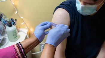 Max gets a bandaid from a Student Health provider