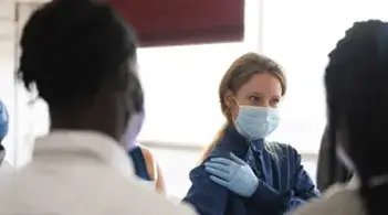 practitioner talks to people