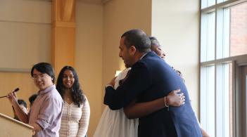 MCSC banquet picture - Ahmed is congratulating a student 