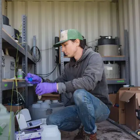 Scientist testing water on a farm