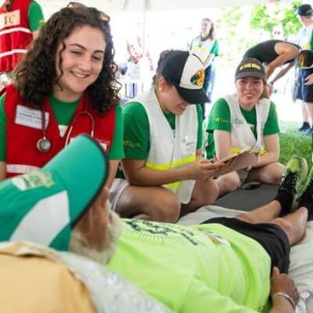 students working in marathon medical tent