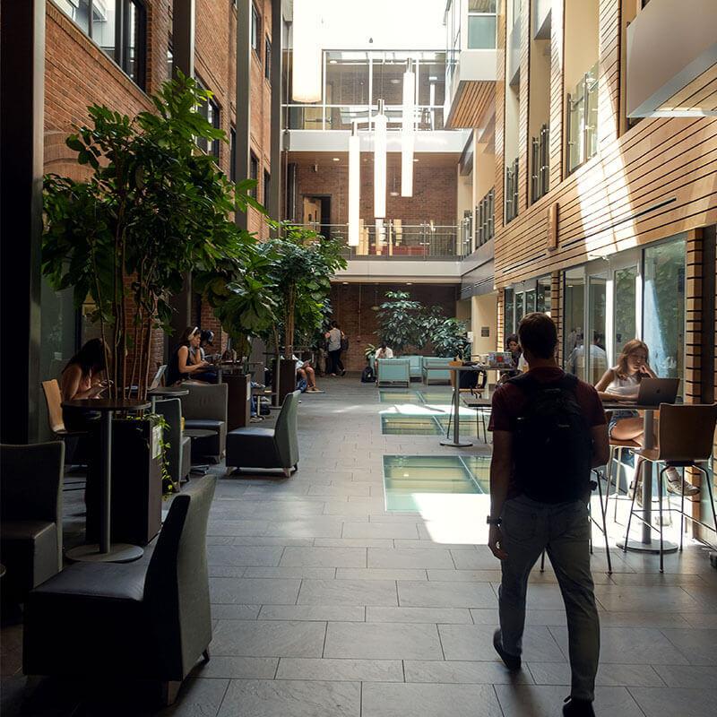 Person walking through Ifshin Hall