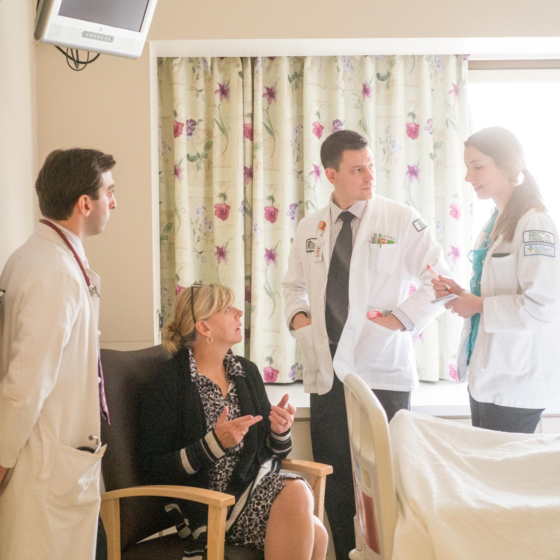 Medical staff talking to patient