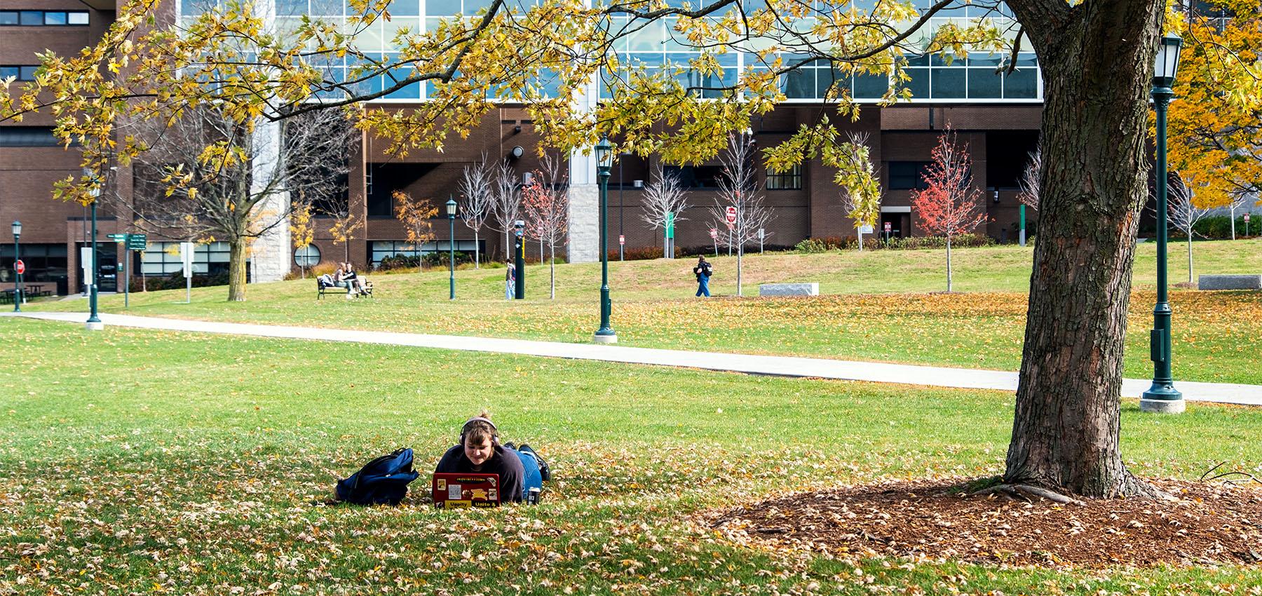 Student Resting on Campus Lawn