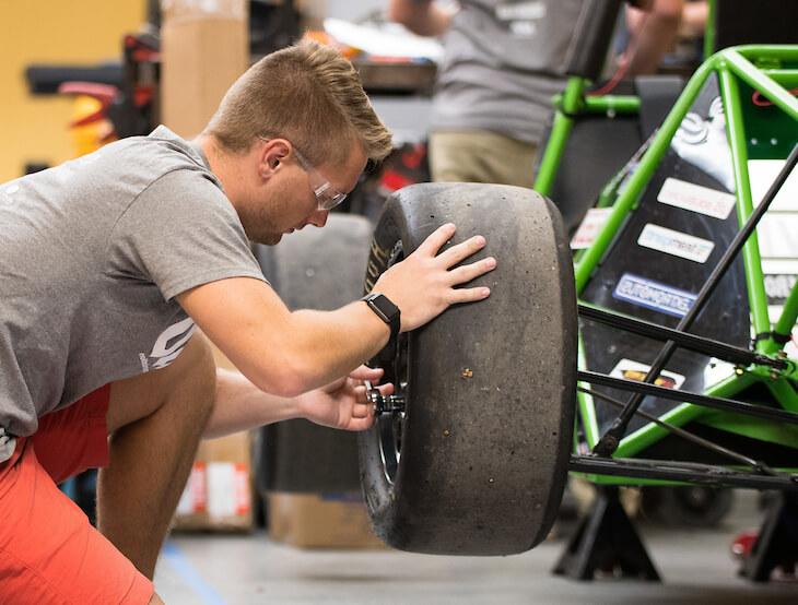 man changing car tire