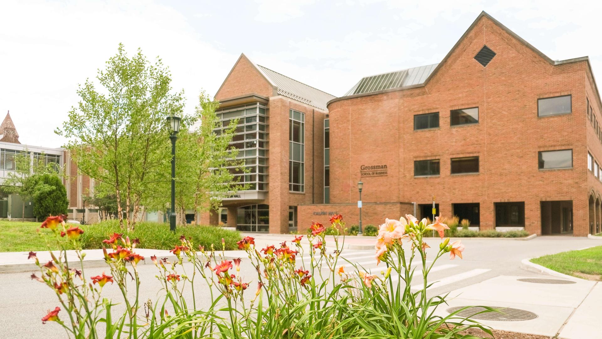 Outside the front of Kalkin Hall in the summer.