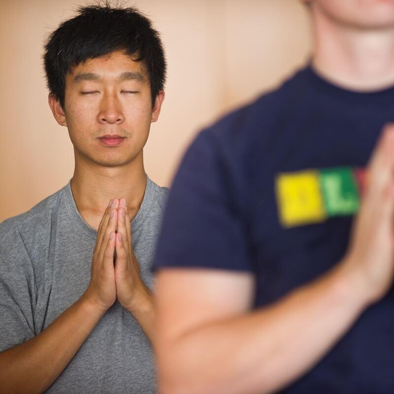 Student practicing yoga during a Wellness event