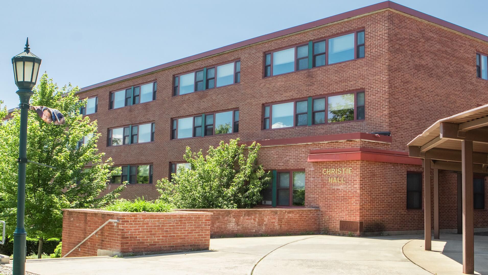 Brick three story residence hall. 