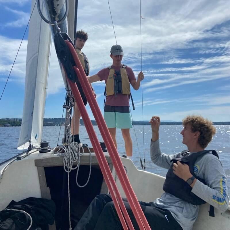 Students on a sailboat out on Lake Champlain. 