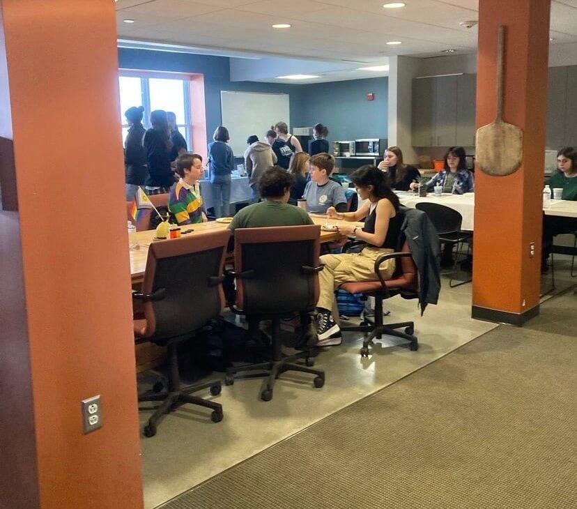 students sitting at tables during a pancake breakfast event