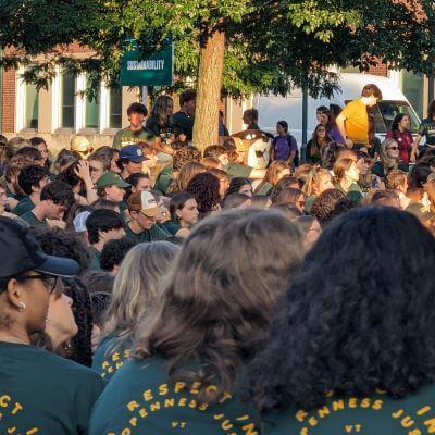 A sea of UVM first years sitting on the green at convocation.