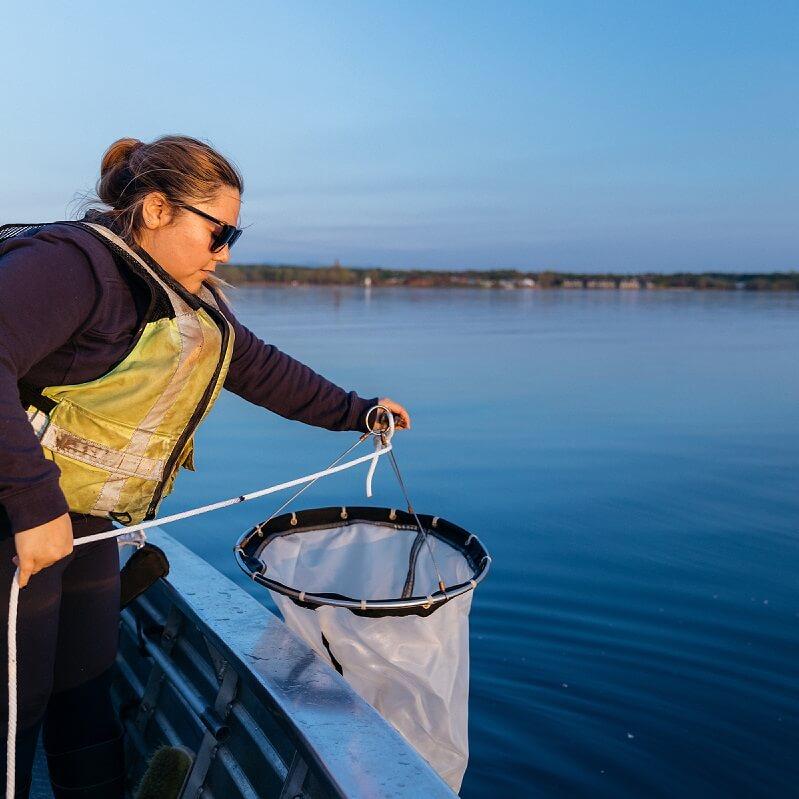 Student Rosie Chapina taking samples on the lake