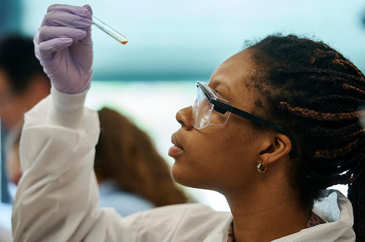 A scientist holding a test tube