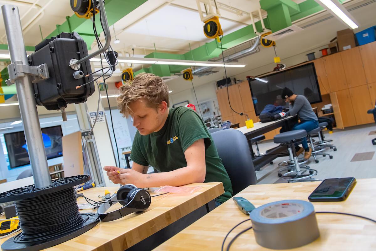 A student works in an engineering lab