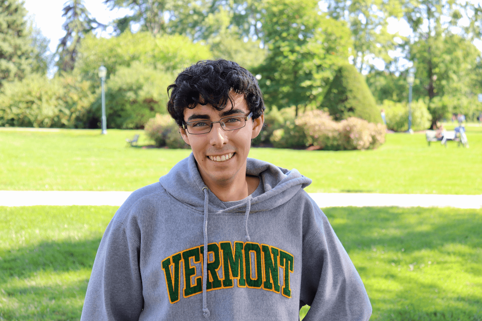 HDFS graduate Ben Schnier smiling on the University Green.