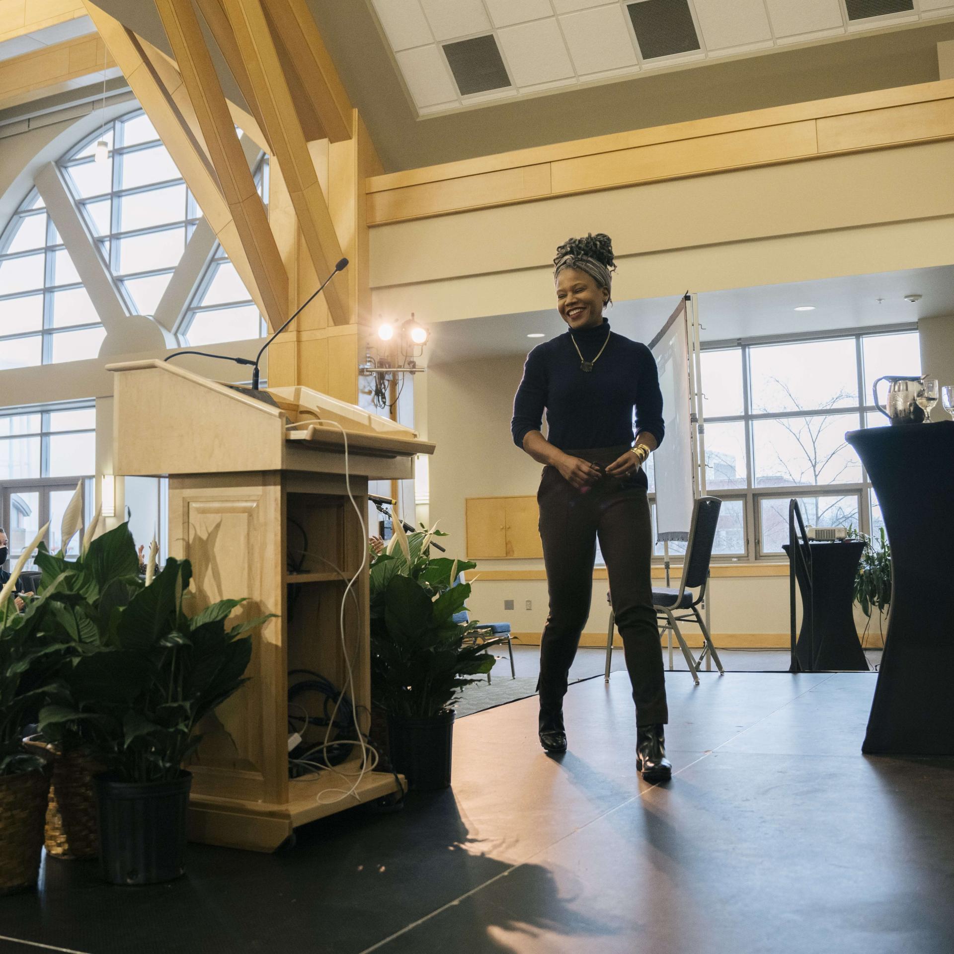 Majora Carter walking to the podium