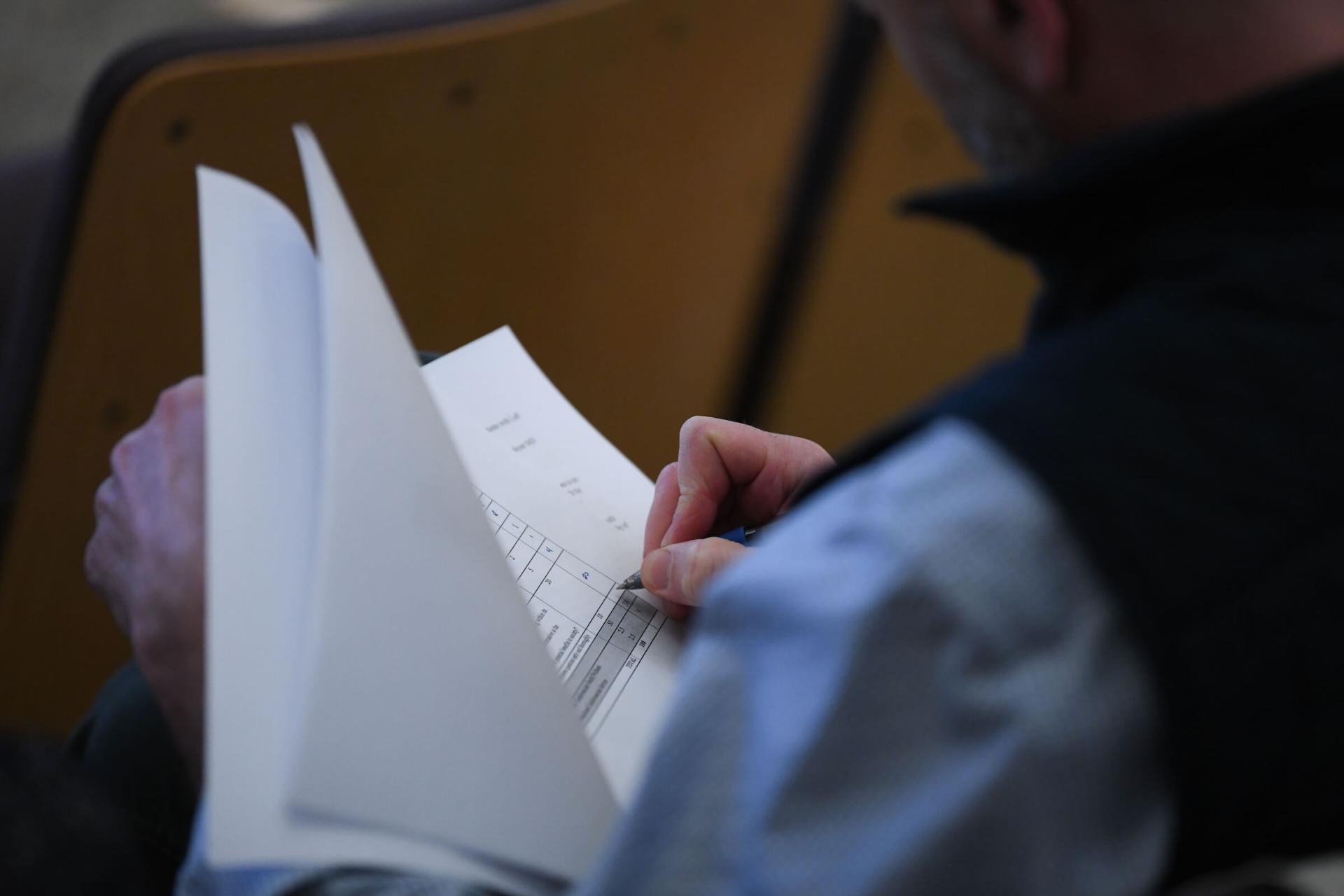 Photo of someone examining a document 