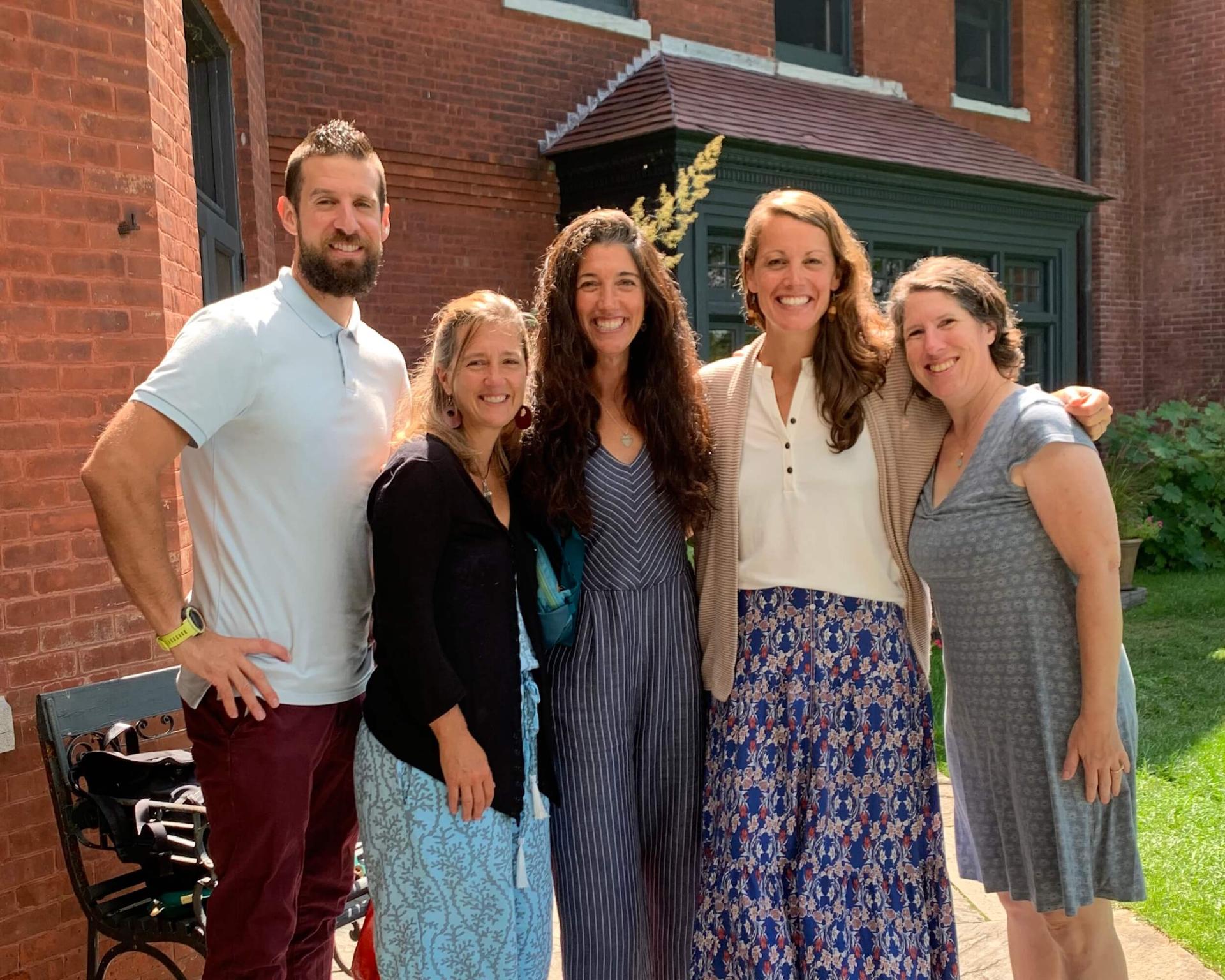 SHIE faculty Justin Garwood, Jessica Strolin-Goltzman, Shana Haines, Bernice Garnett and Colby Baker at together on a sunny summer day at Shelburne Farms.