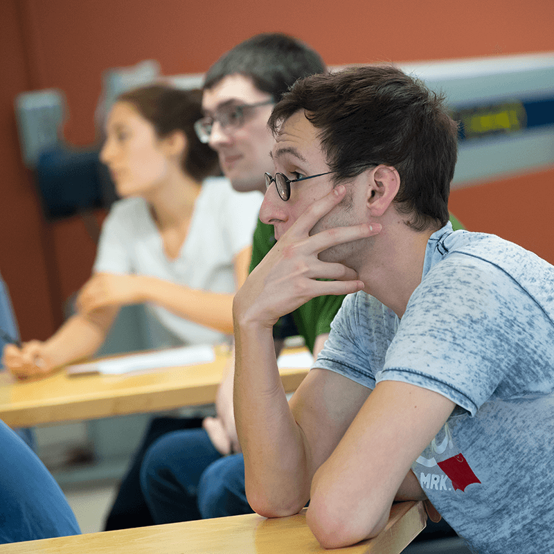 student intently focused on something at the front of their gaze