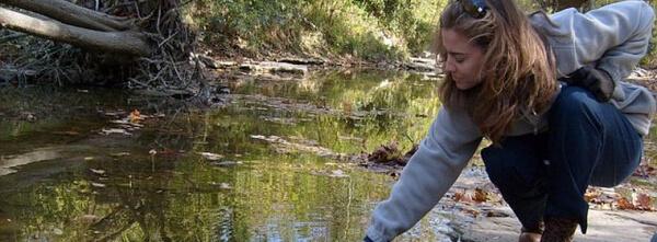 young women by a stream