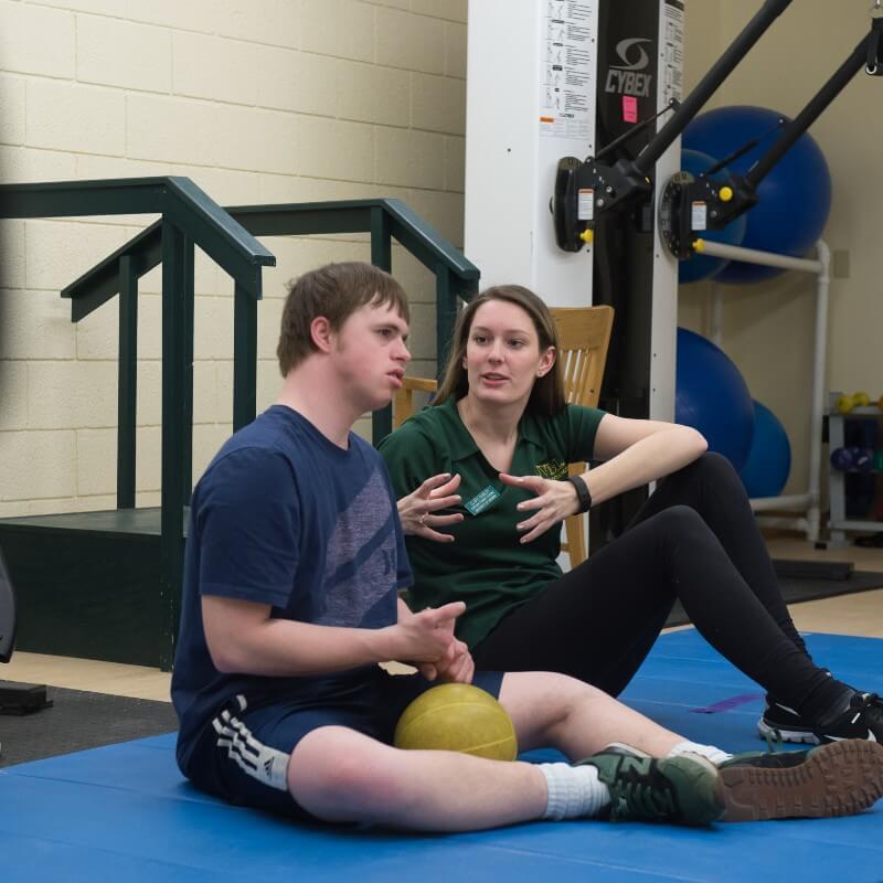 Student works with special olympics athlete