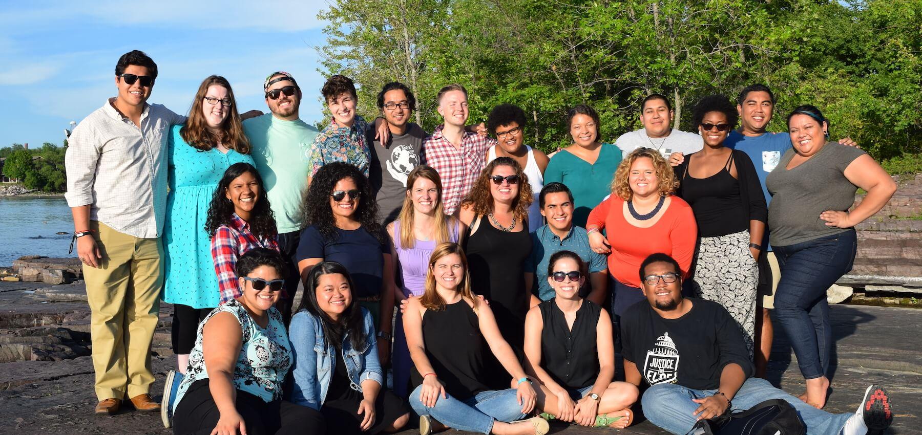 HESA student cohort gathered together by the shore of Lake Champlain