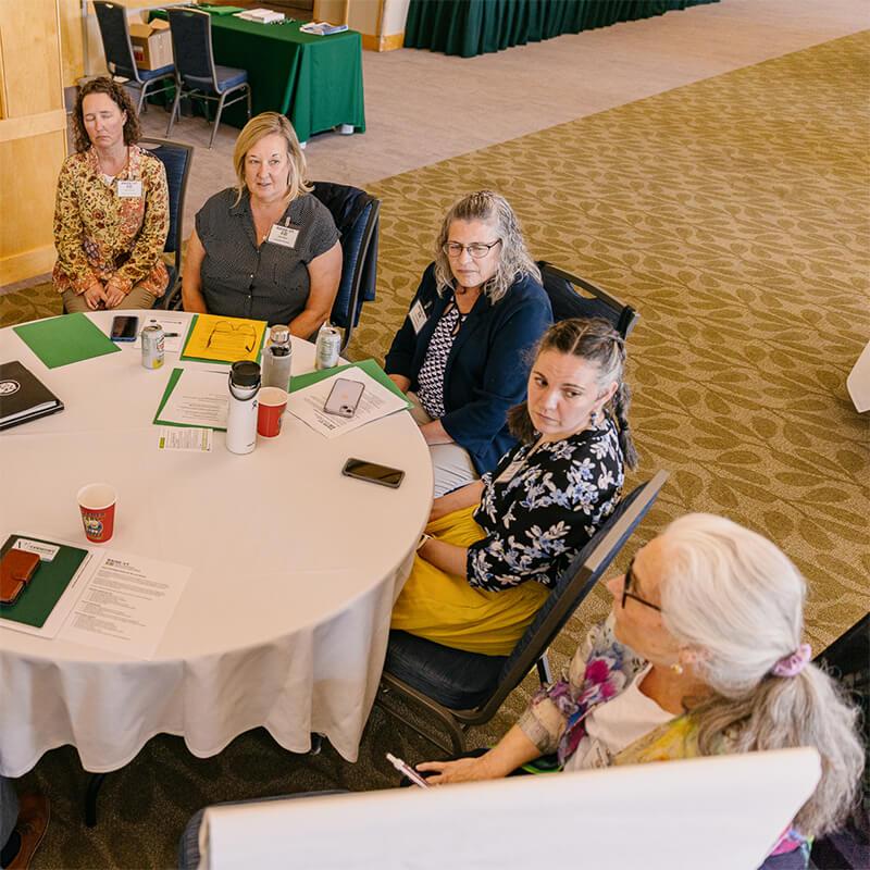 A group of staff members discussing