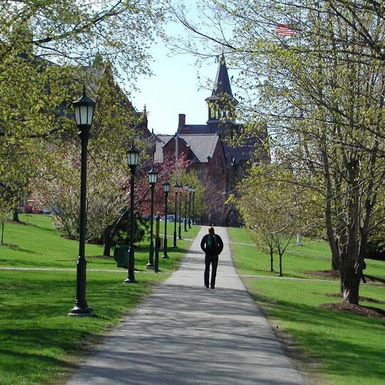 person walking toward on old building