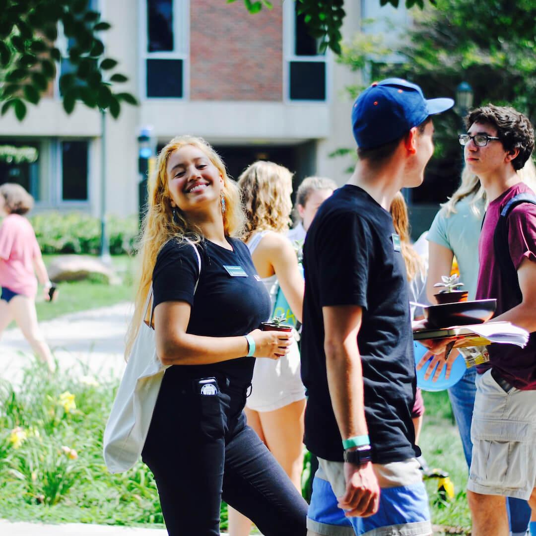 Smiling students head to class.