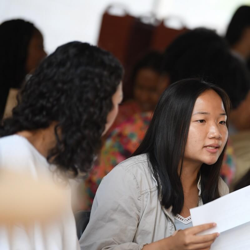 student listens to another person speaking