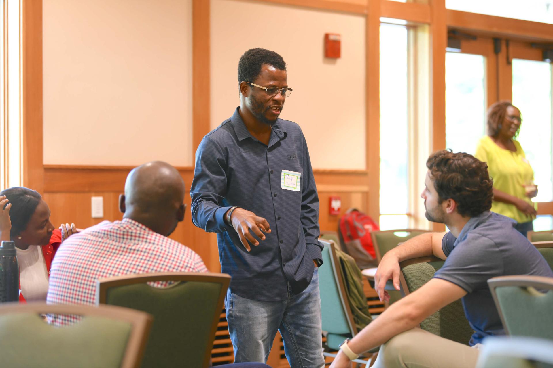 HESA students talking with each other at an event on campus.